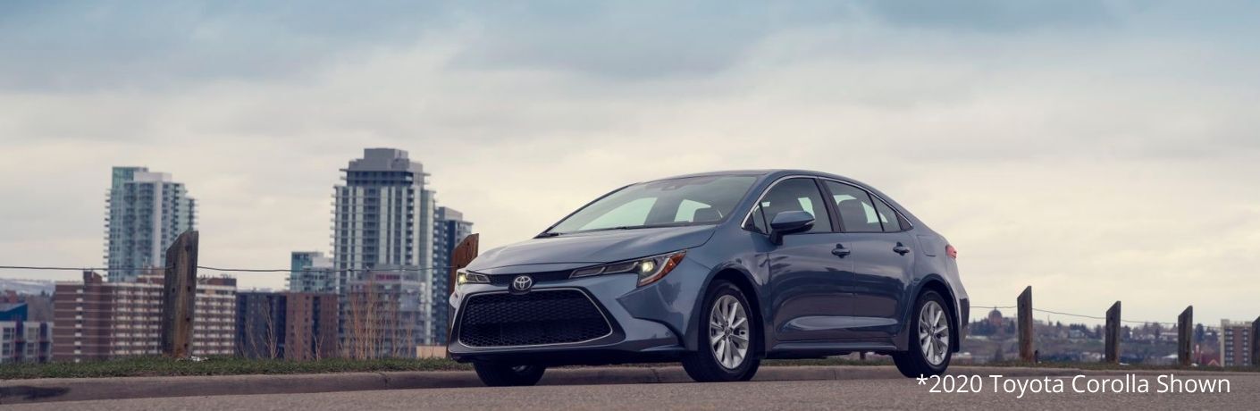A 2020 Toyota Corolla against the cityscape