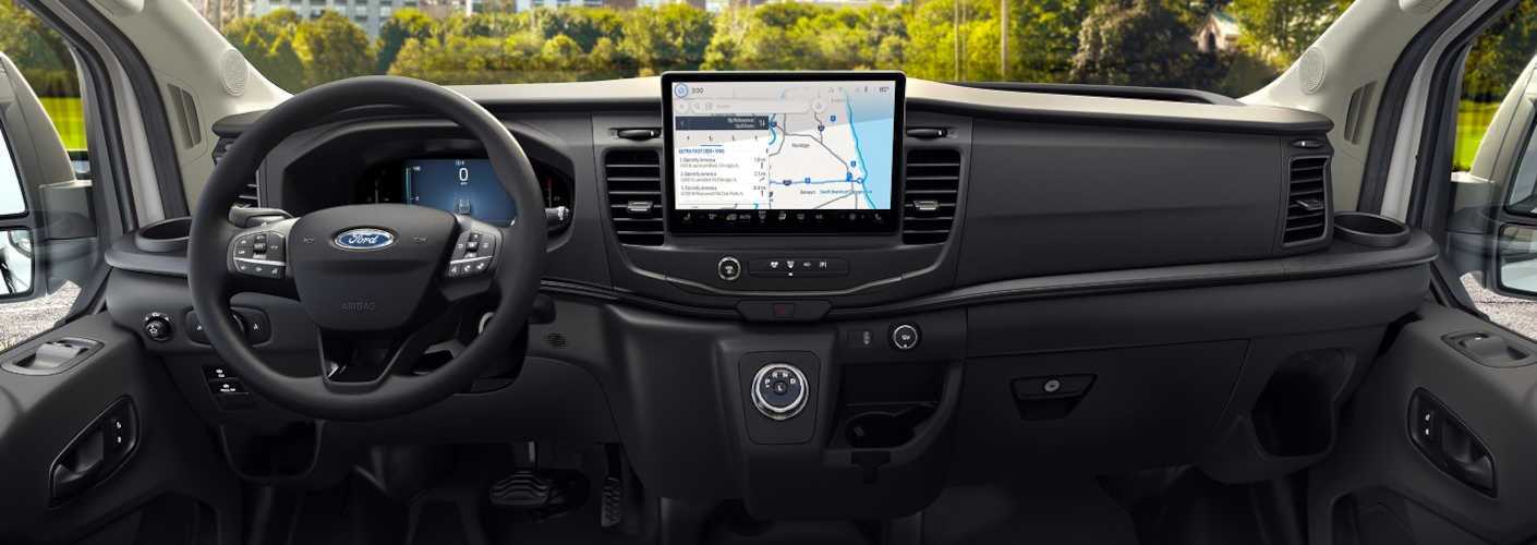 The high-tech cockpit and infotainment system in the 2026 Ford E-Transit