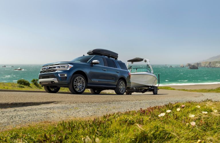 2024 Ford Expedition towing a boat by water