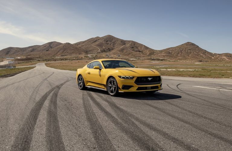 A 2024 Ford Mustang on a smooth road