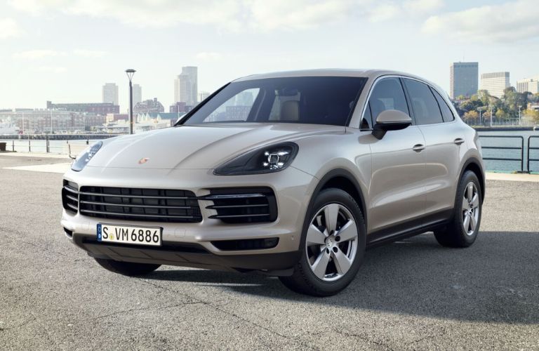 2023 Porsche Cayenne near a water body