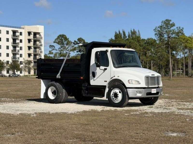 A front quarter exterior view of a Freightliner dump truck
