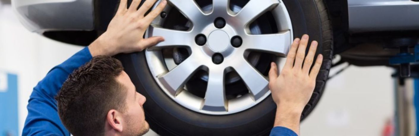 technician fixing a tire