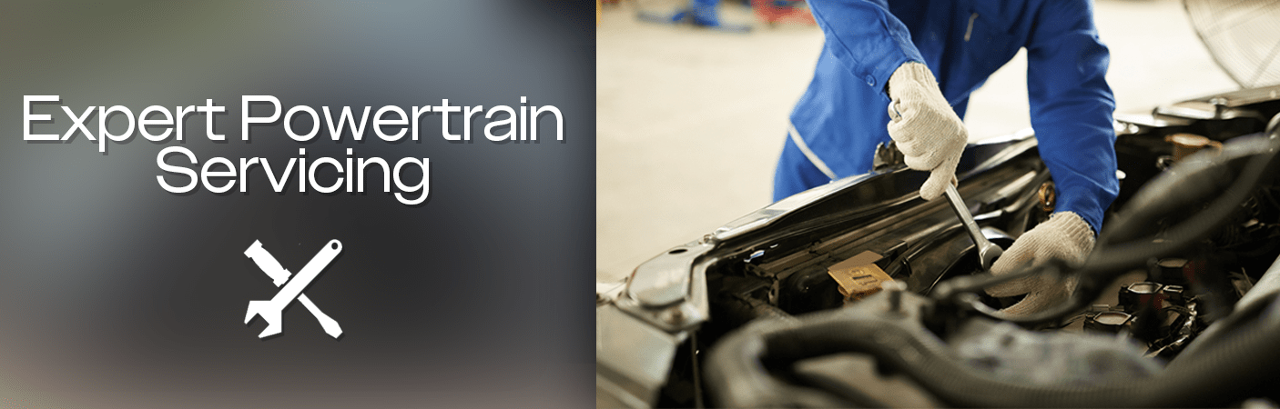 Technicians servicing a powertrain