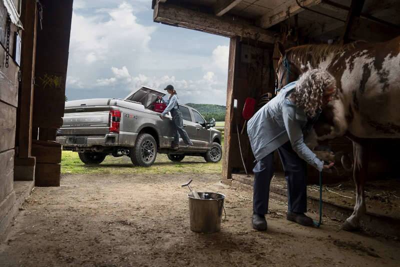 A Ford pickup truck with a Powerstroke engine outside of a barn