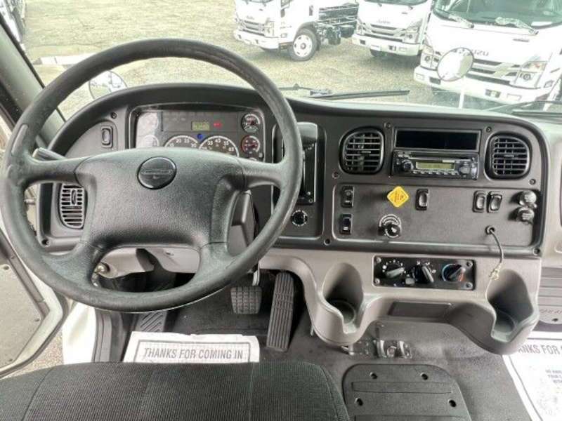 The cockpit of a Freighliner truck
