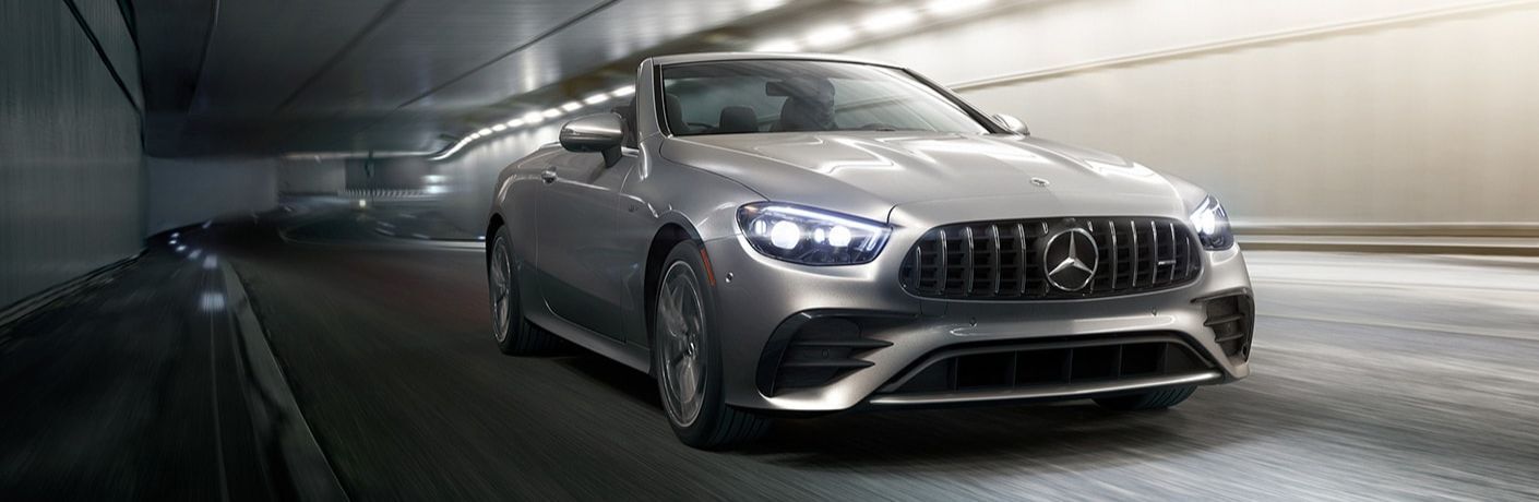 2022 Mercedes-AMG E 53 Cabriolet driving under a tunnel with roofs down