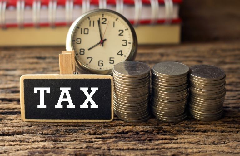 A clock and stacks of coins