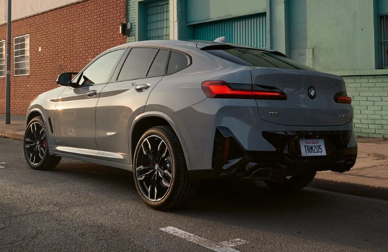 Rear three-quarter view of the 2024 BMW X4 parked