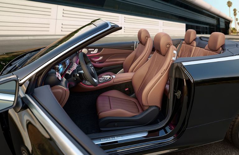 Side view of the 2023 Mercedes-Benz E-Class Cabriolet with opened doors and retracted roof