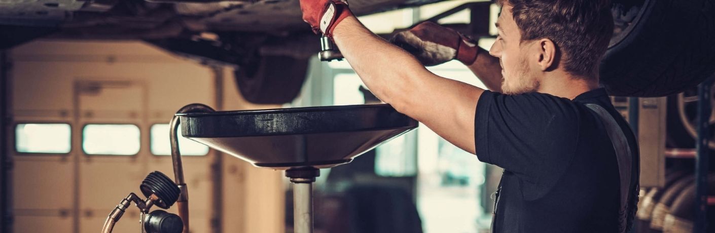 A man checking engine oil
