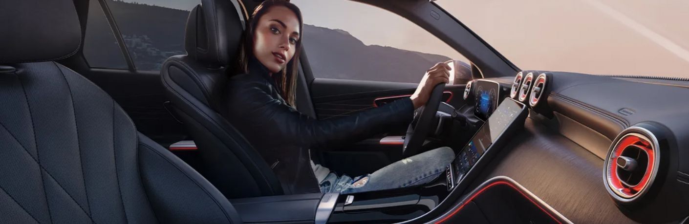 a woman sitting in a Mercedes-Benz