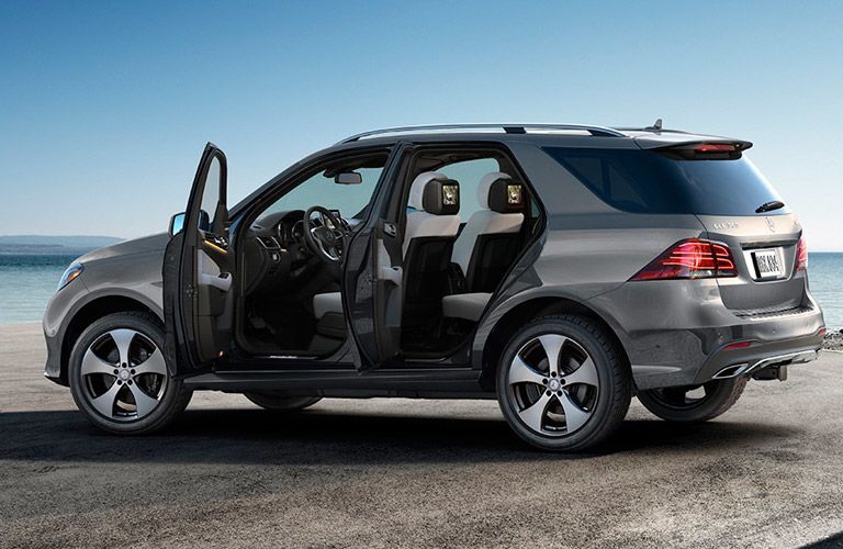 2017 Mercedes-Benz GLE 350 on the beach with two doors open