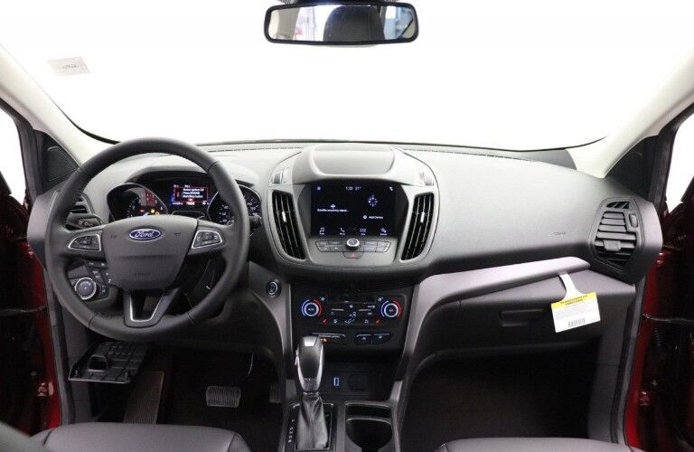 Steering wheel and touchscreen interface inside 2019 Ford Escape SEL