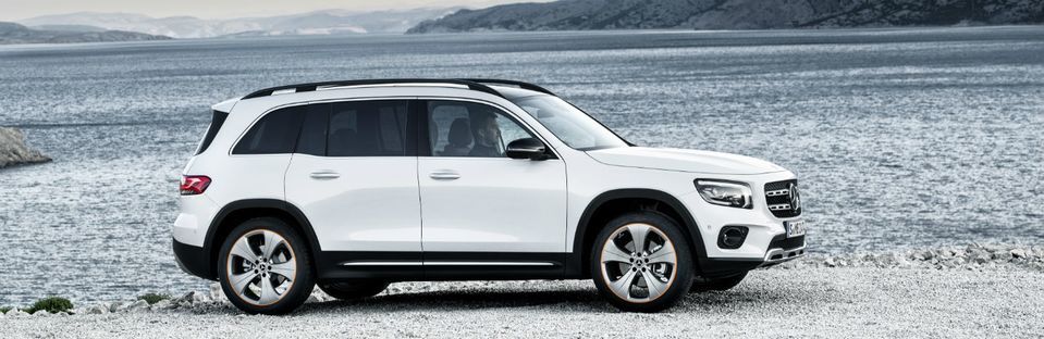 2020 MB GLB exterior passenger side profile in front of lake