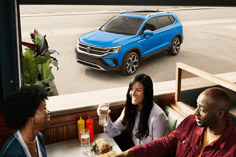 Volkswagen parked outside of restaurant