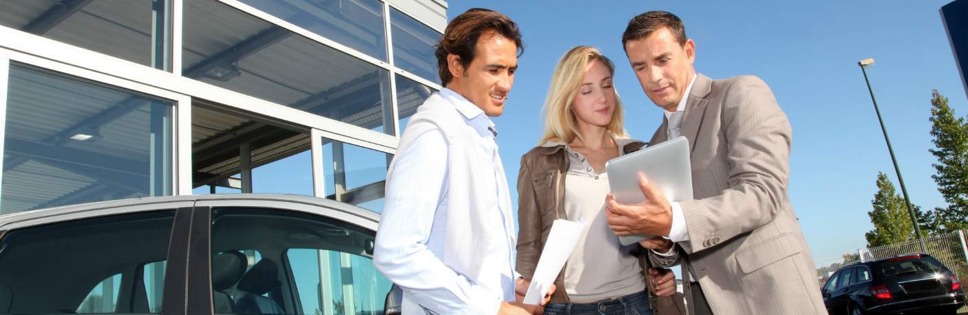 Man showing couple some paperwork