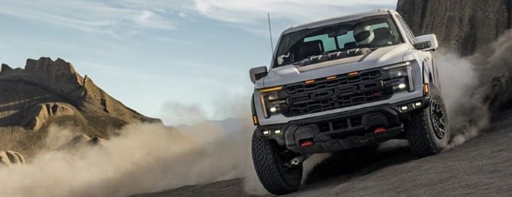2025 Ford F-150 front view kicking up dust