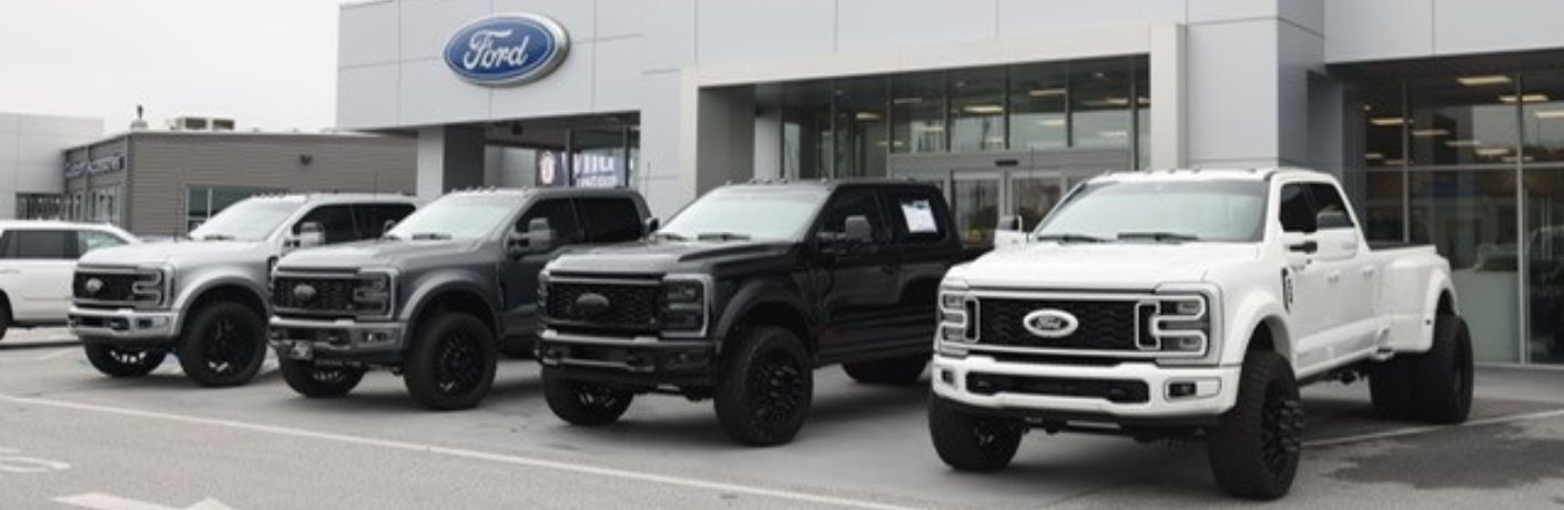 2025 Ford F-450 trucks in front of Akins Ford