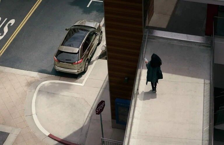 Overhead view of 2020 Ford Edge SE on city curb
