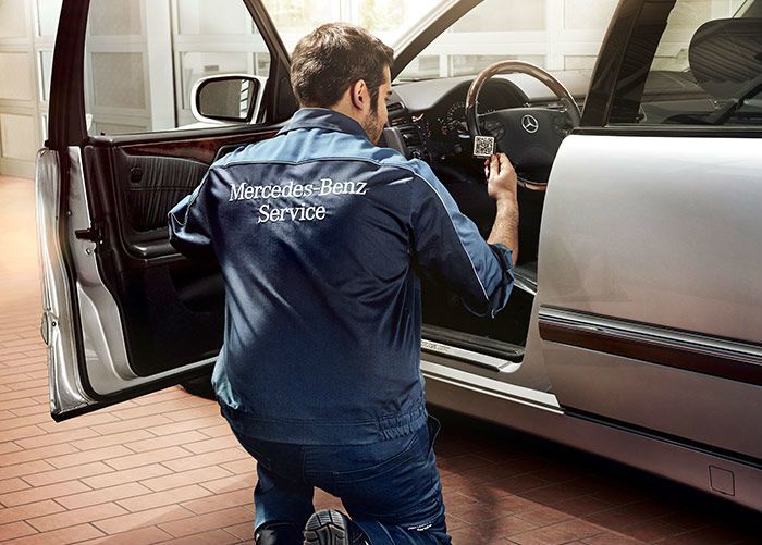 Mercedes-Benz service tech working on a car