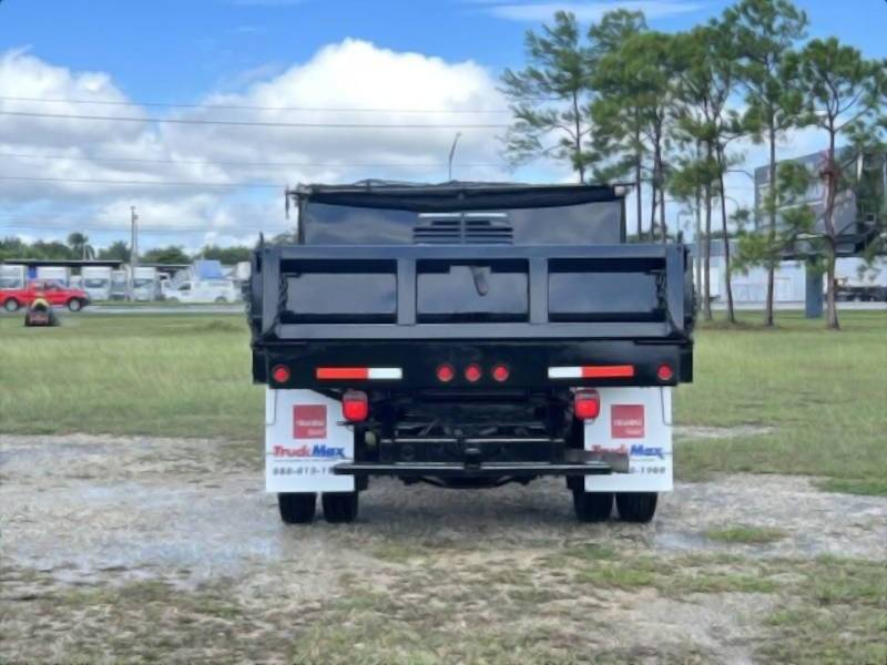 A rear exterior view of a Ford dump truck