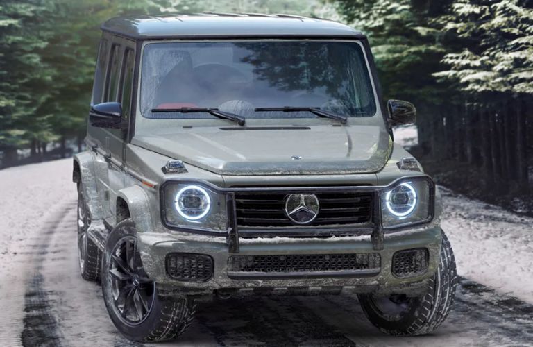 front view of the 2025 Mercedes-Benz G-Class SUV being driven in snow