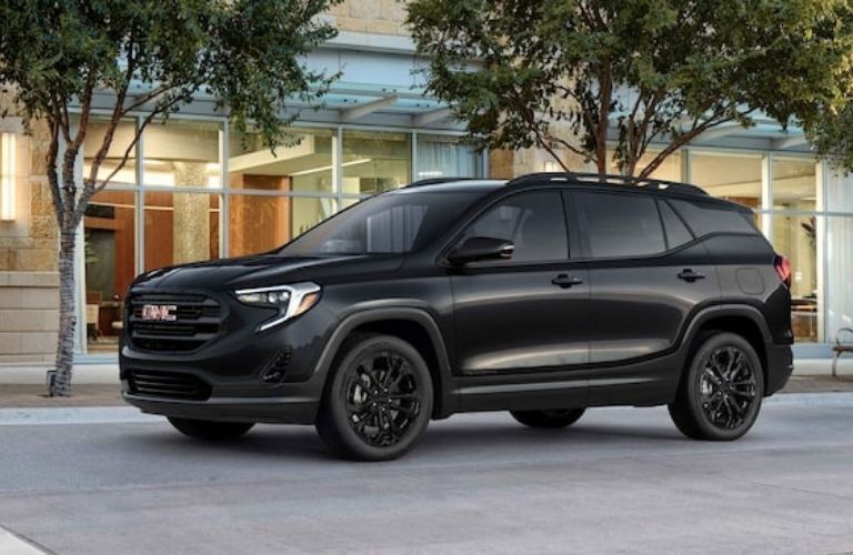 GMC Terrain SUV parked outside a building