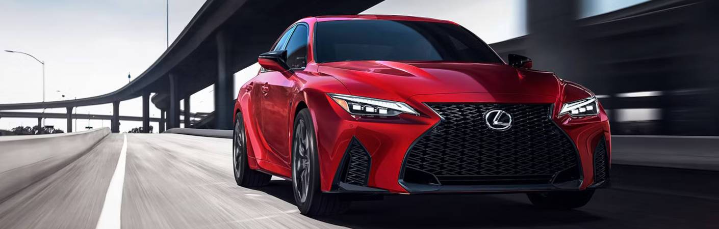 A front quarter view of a red, pre-owned Lexus IS model.