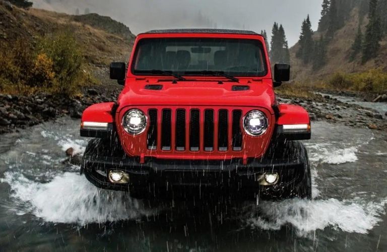 Front view of the 2022 Jeep Wrangler off-roading through water