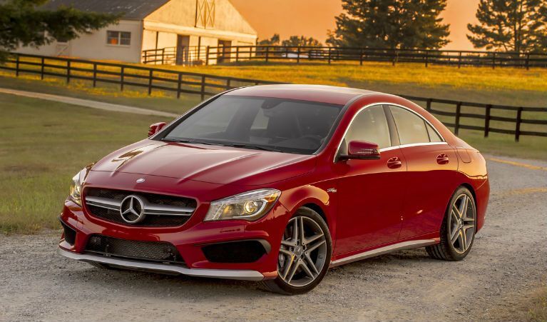 red Mercedes-Benz CLA parked outside ranch