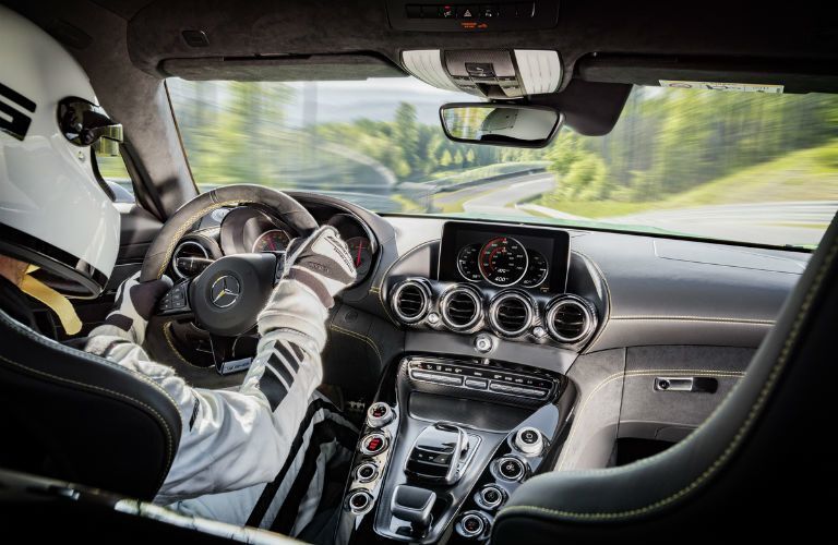 Race car driving in the driver's seat of the 2017 AMG® GT R