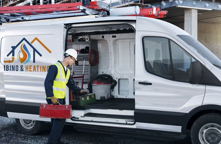 2025 Ford Transit Cargo Van with a worker