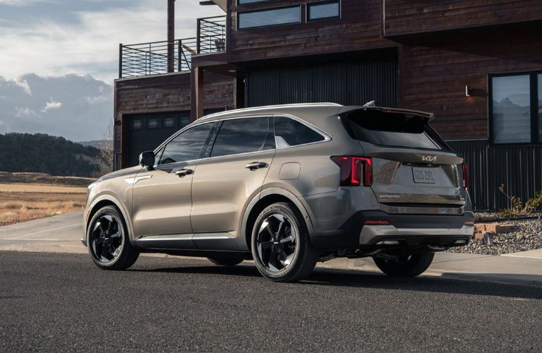 2025 Kia Sorento Plug-in Hybrid on a road near a house