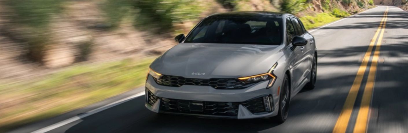 2025 Kia K5 driving on a road