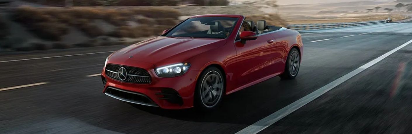 Front three-quarter view of the 2023 Mercedes-Benz E-Class Cabriolet driving