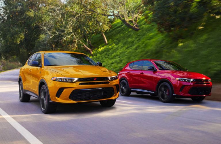 Two 2023 Dodge Hornet driving on the road