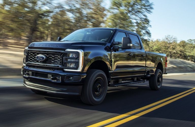 A 2024 Ford Super Duty speeding on a road