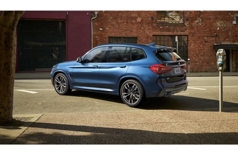 2020 BMW X3 by a parking meter