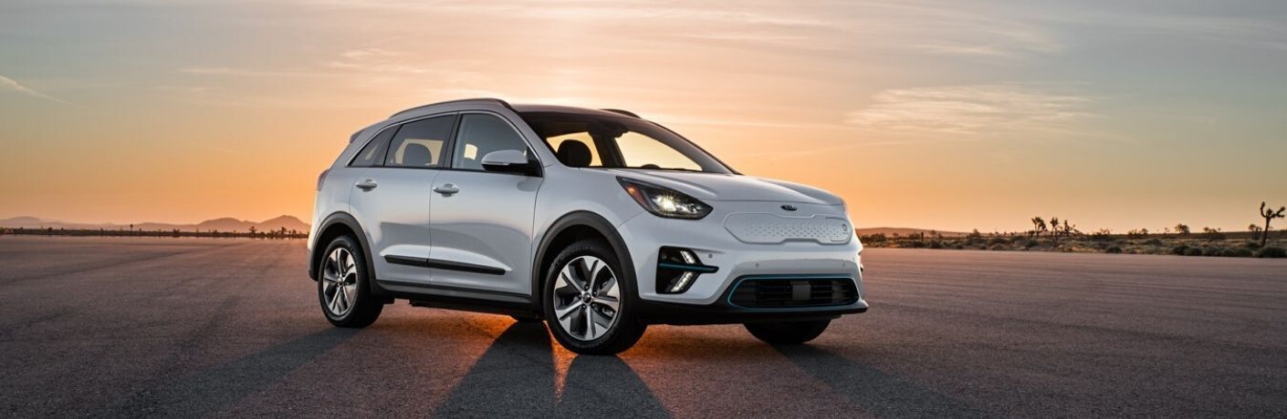 White 2020 Kia Niro Plug-In Hybrid on a Runway at Sunset