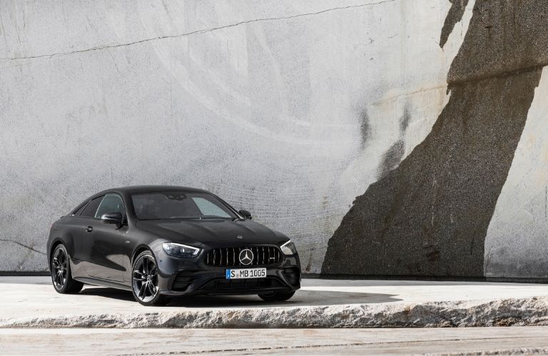 2021 MB E-Class Coupe exterior front fascia passenger side in front of white wall