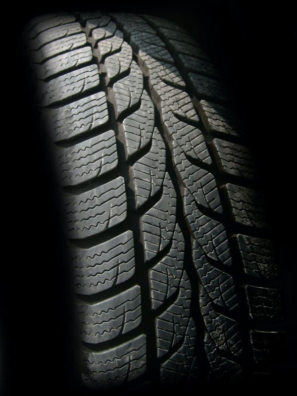 A close-up image of a brand new tire.