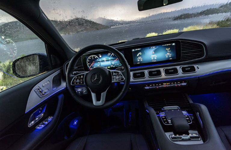 2020 MB GLS interior front cabin steering wheel and dashboard with lake and mountains in window