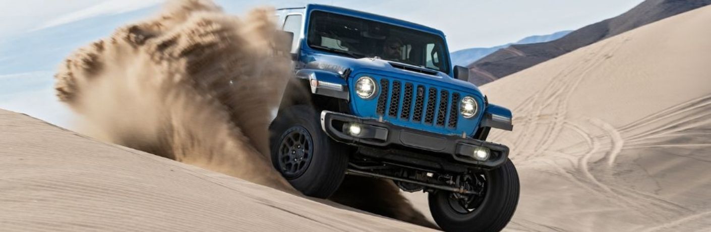 front view of the 2022 Jeep Wrangler off-roading in a desert