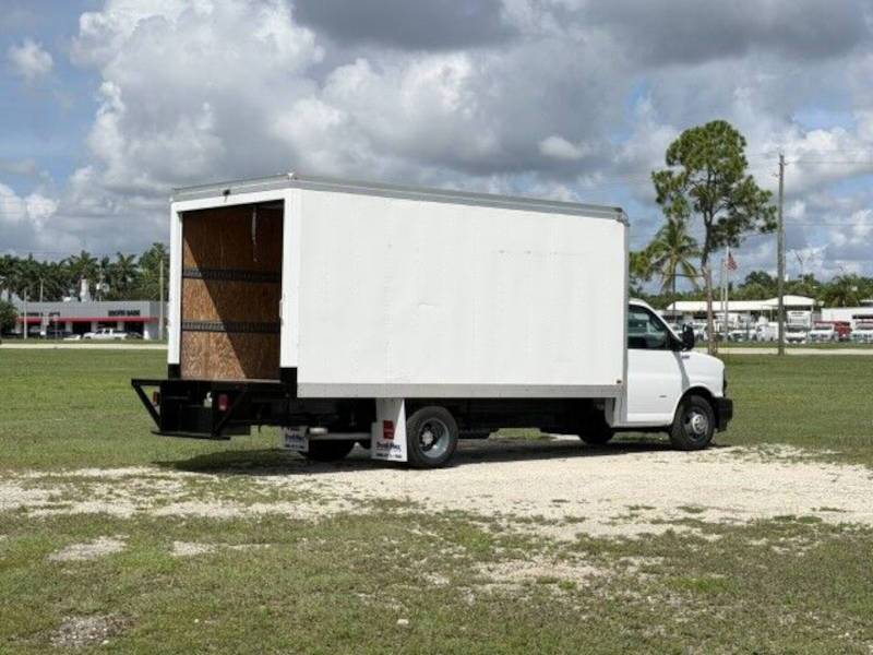 A rear exterior view of a vanscaper box truck