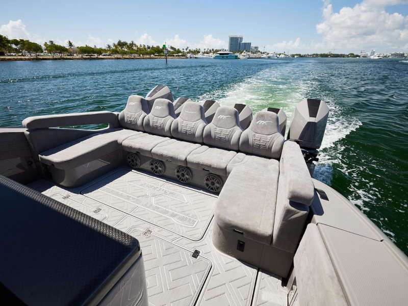 The rear exterior deck with seating on the 2026 Midnight Express 52 Mansory
