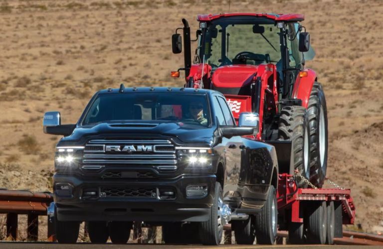 2026 Ram 3500 towing a tractor