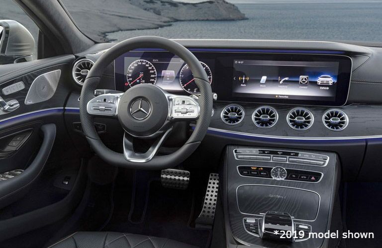2020 MB CLS interior front cabin steering wheel and partial dashboard with lake in window
