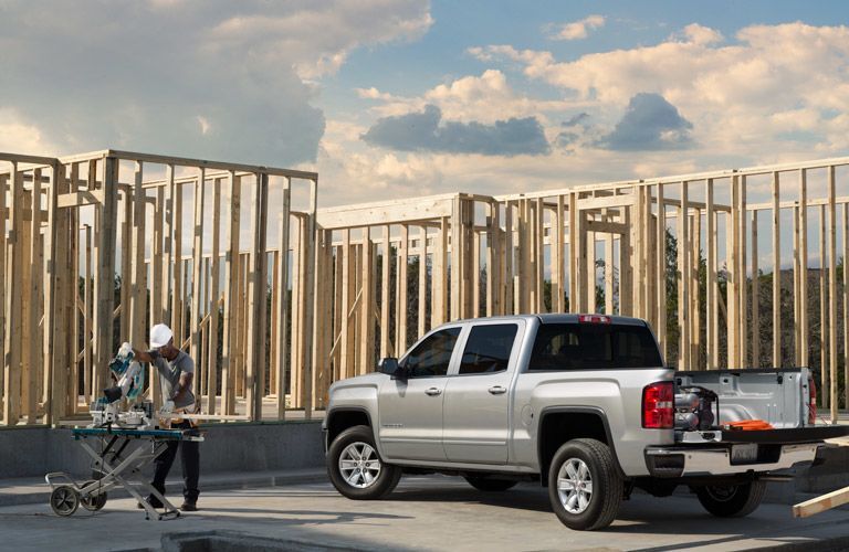 GMC Sierra in front of house being constructed