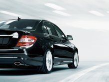 A Mercedes-Benz sedan driving